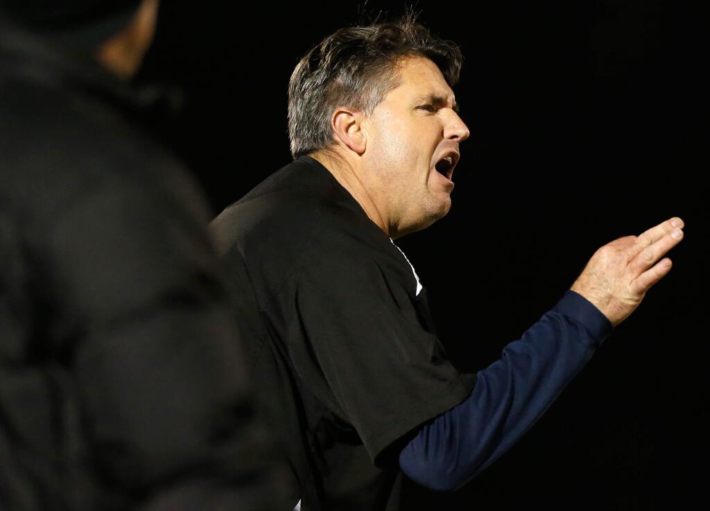 Cardinal Newman head coach Paul Cronin yells to his offensive players after a near interception during first half of the NCS Division 4 championship football game between Cardinal Newman and St. Bernard's high schools, in Rohnert Park, California, on Saturday, December 3, 2016. (Alvin Jornada / The Press Democrat)