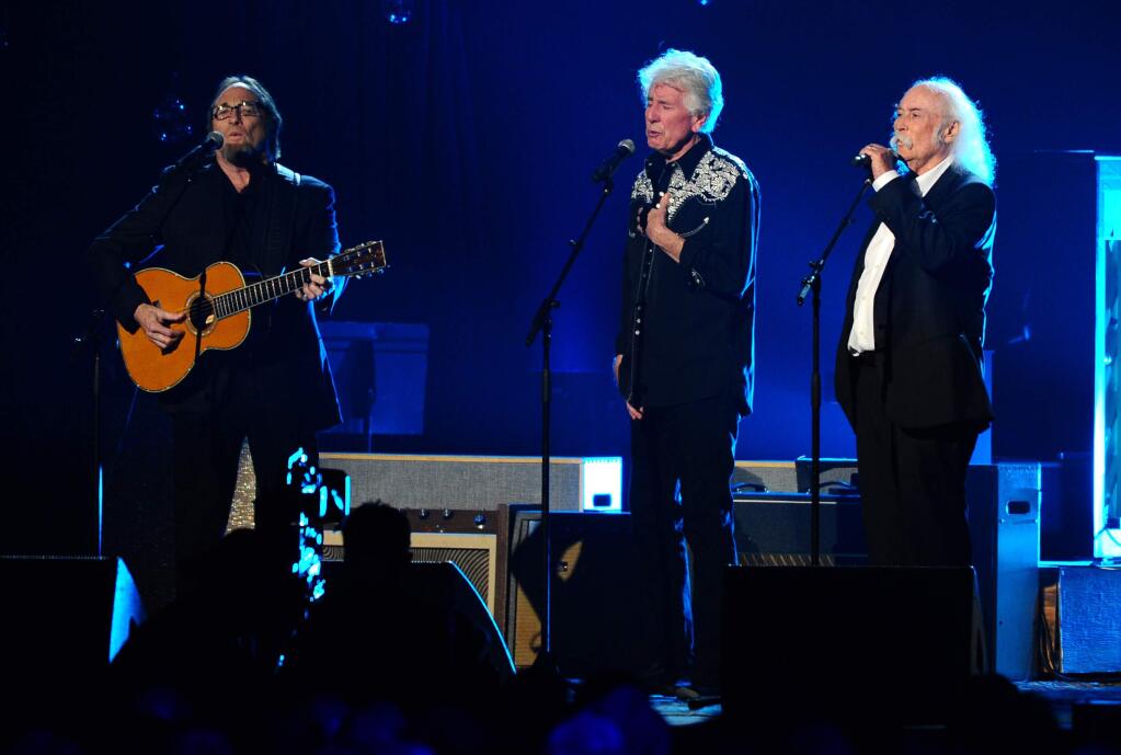 From left, Stephen Stills, Graham Nash and David Crosby perform on stage at the 2015 MusiCares Person of the Year show at the Los Angeles Convention Center on Friday, Feb. 6, 2015, in Los Angeles. (Photo by Vince Bucci/Invision/AP)