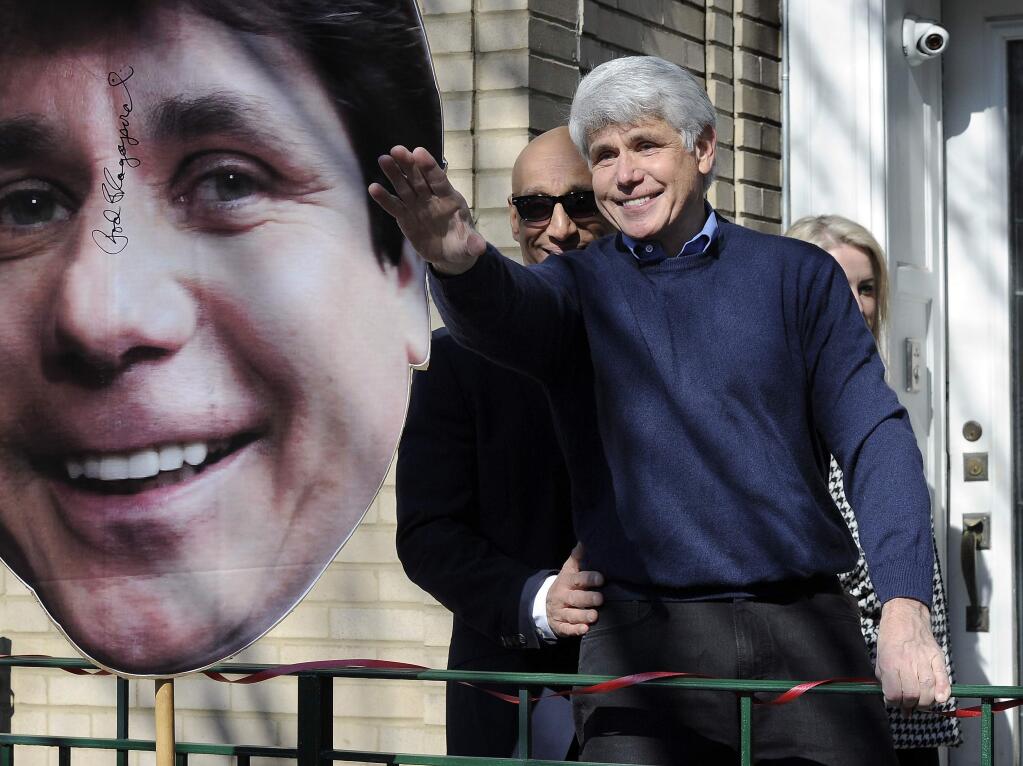 Former Illinois Gov. Rod Blagojevich waves to his friends after giving a press conference at his Chicago home on Wednesday, Feb. 19, 2020, one day after having his prison sentence commuted by President Donald Trump. (Mark Welsh/Daily Herald via AP)/Daily Herald via AP)
