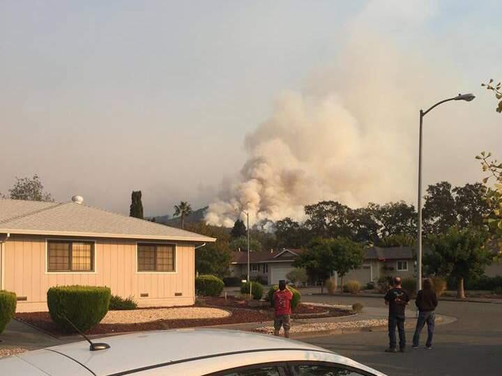 A plume of smoke is seen on Bennett Peak, shot from a neighborhood near Strawberry School in Santa Rosa, Wednesday, Oct. 11, 2017 around 5 p.m. (GINA WILLIAMS)