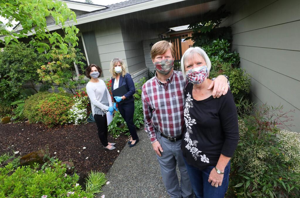 Elissa, right, and Kevin DeWolfe are putting their Oakmont area home on the market with Compass listing agents Karen Moyers and Katie Kelly now that shelter in place restrictions are gradually being relaxed.(Christopher Chung/ The Press Democrat)