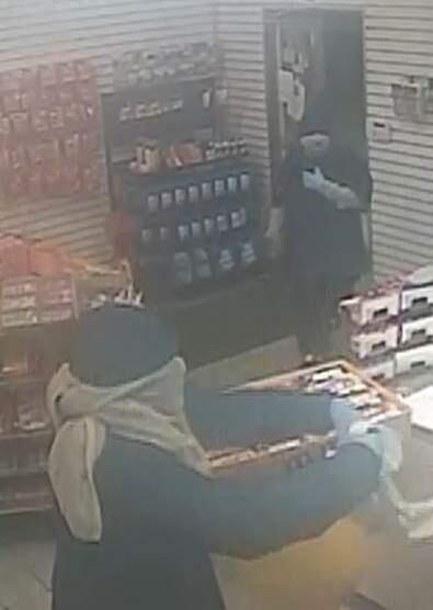 A photo released by the Rohnert Park Department of Public Safety shows two men suspected of robbing a Valero gas station Sunday evening.