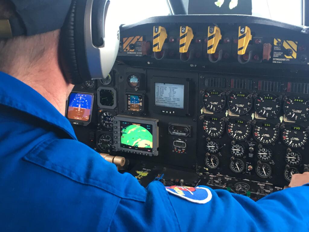 A pilot at the controls of a NOAA hurricane hunting aircraft.(Lucrezia Ricciardulli)