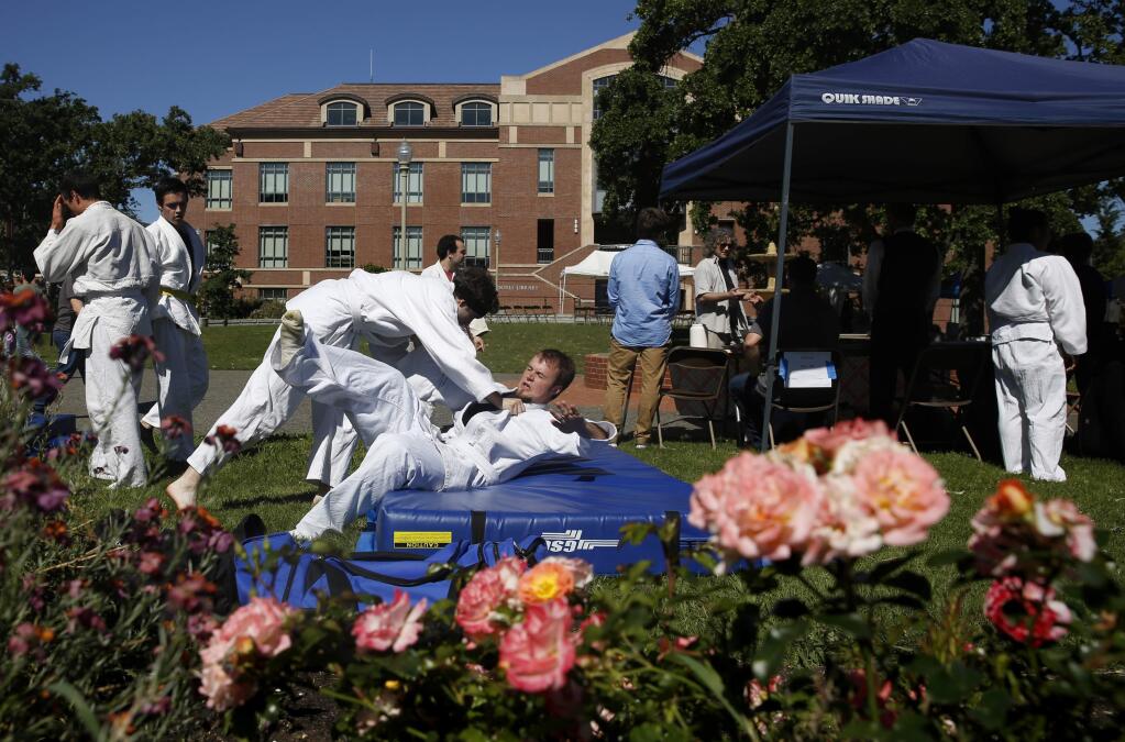 Members of the Judo Club demonstrate their skills during the Larry Bertolini Day Under the Oaks at the Santa Rosa Junior College campus on Sunday, May 1, 2016. (BETH SCHLANKER / The Press Democrat)