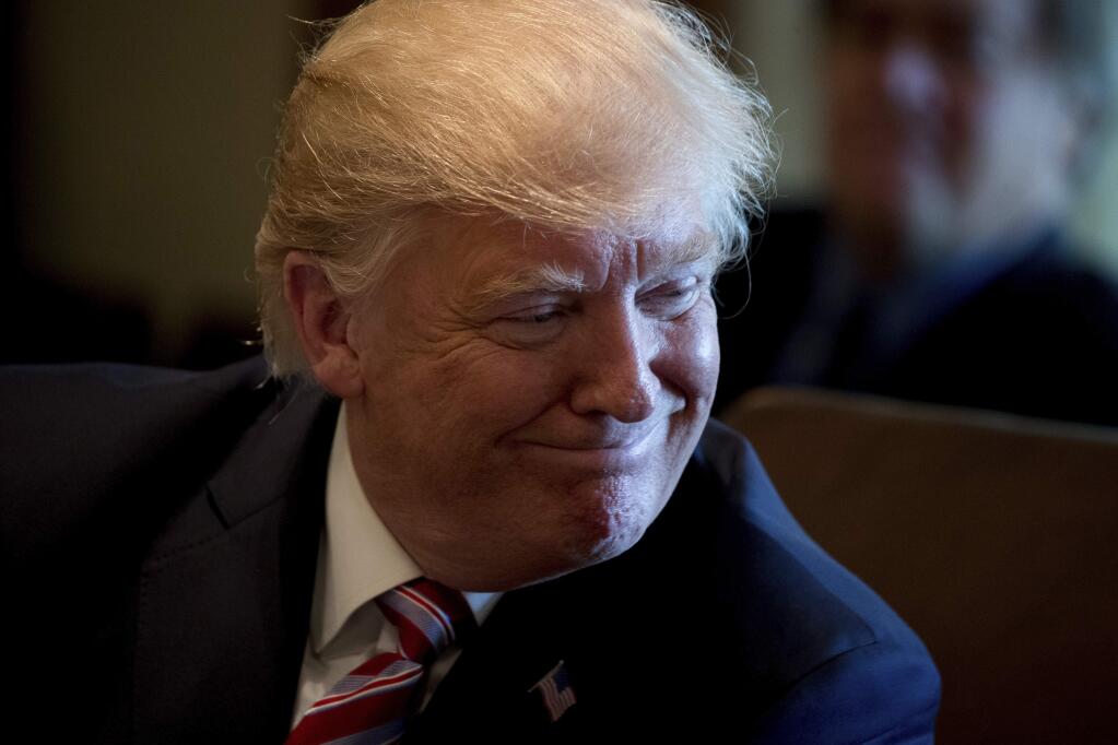 President Donald Trump smiles during a Cabinet meeting, Monday, June 12, 2017, in the Cabinet Room of the White House in Washington. (AP Photo/Andrew Harnik)