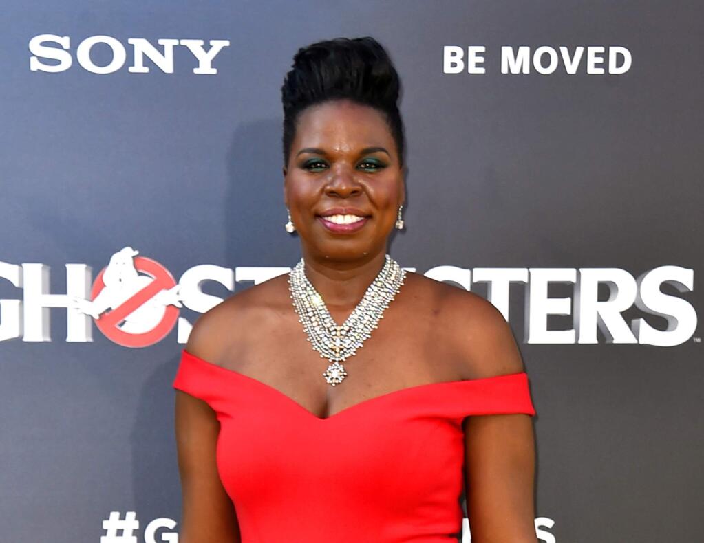 FILE - In this July 9, 2016 file photo, Leslie Jones arrives at the Los Angeles premiere of 'Ghostbusters.' ‘Ghostbusters' and ‘Saturday Night Live' star Jones is joining NBC's team at the Olympics in Rio, NBC announced on Monday, Aug. 8. NBC's top producer invited Jones after seeing a serious of cheerleading tweets she sent about the Olympic games .(Photo by Jordan Strauss/Invision/AP, File)