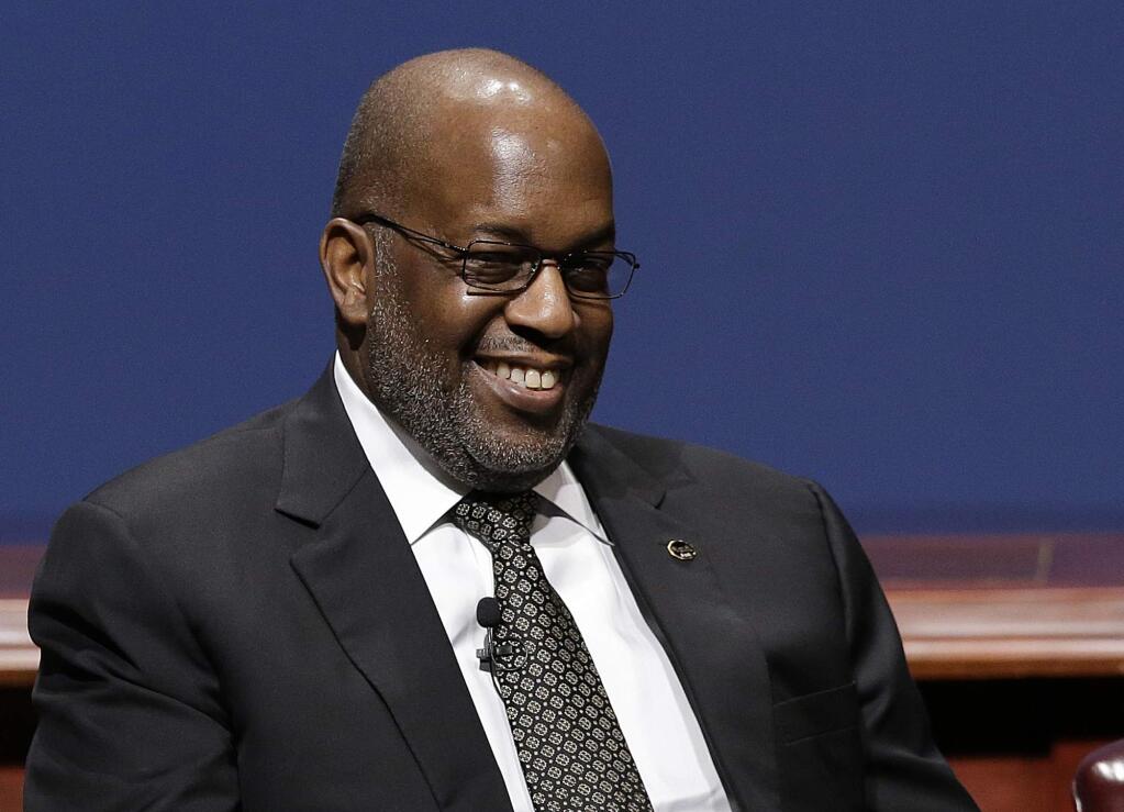FILE - In this Friday, Feb. 13, 2015, file photo, Bernard Tyson, chairman and CEO of Kaiser Permanente, smiles while sitting on a panel at the White House Summit on Cybersecurity and Consumer Protection in Stanford, Calif. Health care provider Kaiser Permanente said Sunday, Nov. 10, 2019, that Tyson died earlier in the day, at the age of 60. (AP Photo/Jeff Chiu, File)