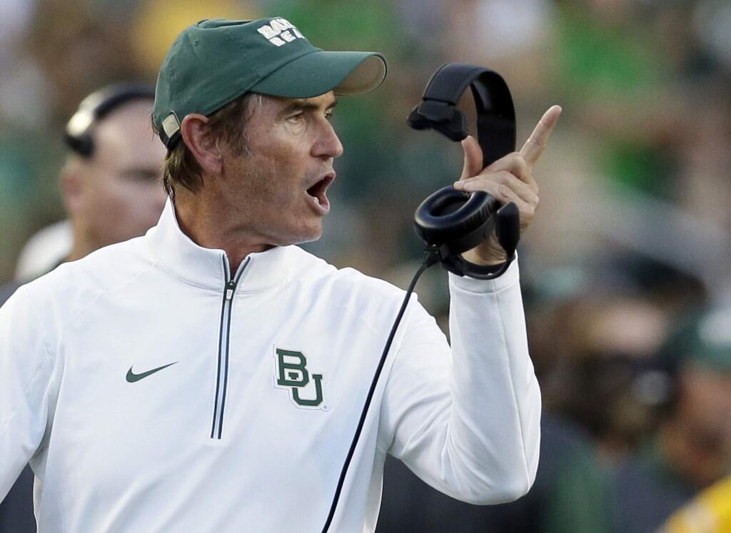 FILE - In this Sept. 12, 2015, file photo, Baylor coach Art Briles yells from the sideline during the first half of an NCAA college football game against Lamar in Waco, Texas. Baylor University's board of regents says it will fire Briles and re-assign university President Kenneth Starr in response to questions about its handling of sexual assault complaints against players. The university said in a statement Thursday, May 26, 2016, that it had suspended Briles 'with intent to terminate.' Starr will leave the position of president on May 31, but the school says he will serve as chancellor. (AP Photo/LM Otero, File)