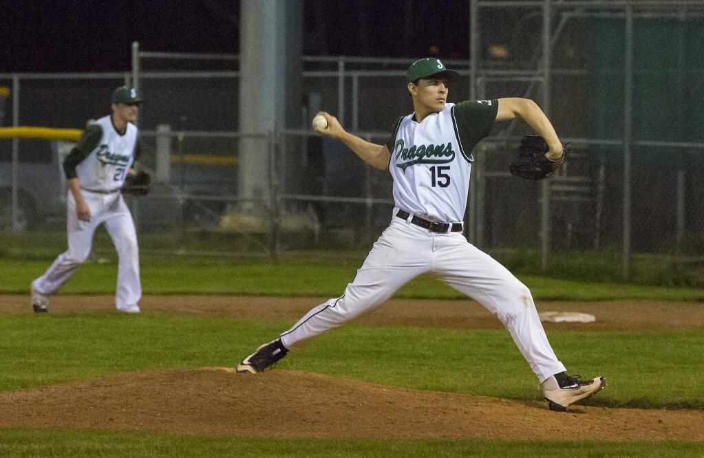Pitcher Eric Bailey hurls into the night in the Sonoma Valley vs. Napa game at Arnold Field. The Dragons came up short, 11-7. (Photo by Robbi Pengelly/Index-Tribune)