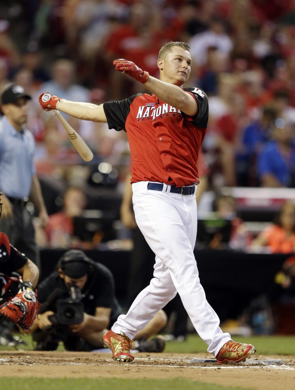 National Leagueís Joc Pederson, of the Los Angeles Dodgers, watches his first home run during the MLB All-Star baseball Home Run Derby, Monday, July 13, 2015, in Cincinnati. (AP Photo/Jeff Roberson)