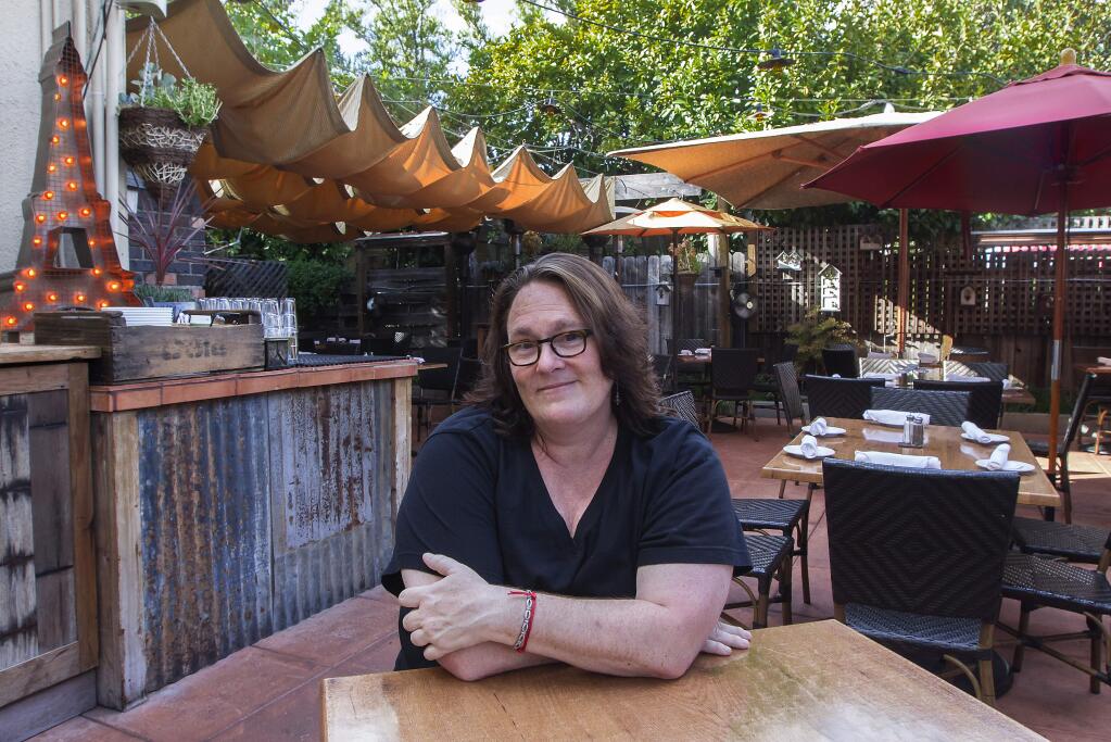 Robbi Pengelly/Index-TribuneSondra Bernstein, owner of the girl & the fig, was impressed with the woodwork at Heritage Salvage, and purchased some furniture for the patio at the restaurant.