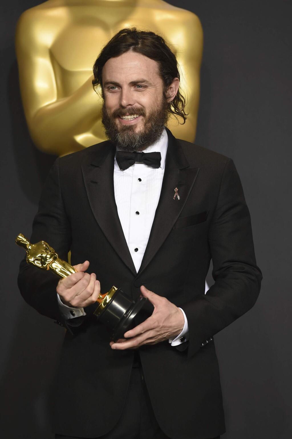 Casey Affleck poses in the press room with the award for best actor in a leading role for 'Manchester by the Sea' at the Oscars on Sunday, Feb. 26, 2017, at the Dolby Theatre in Los Angeles. (Photo by Jordan Strauss/Invision/AP)