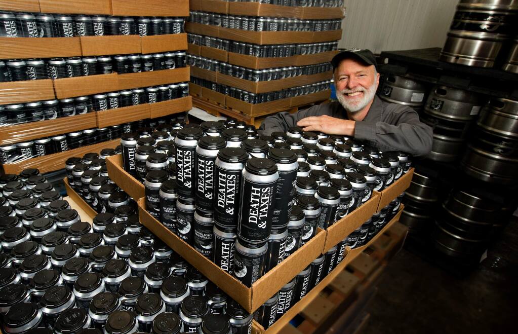 Santa Rosa brewer Brian Hunt has canned his first 376 cases of 'single serving kegs' of Death & Taxes, the signature beer of the Moonlight Brewing Company. (Photo by John Burgess/The Press Democrat)