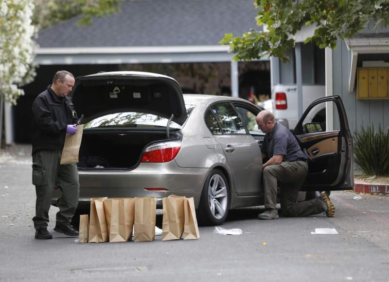 Sonoma County sheriff's deputies and detectives collect evidence from a gang-related shooting near a Corby Avenue apartment complex on July 6, 2015. (BETH SCHLANKER/ PD FILE)
