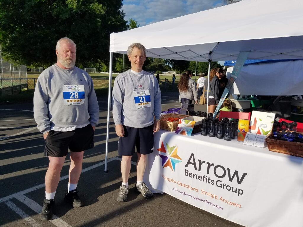 Arrow Benefits Group booth and volunteers at the 2017 Human Race with CEO Jordan Shields (left) and President Keith McNeil.