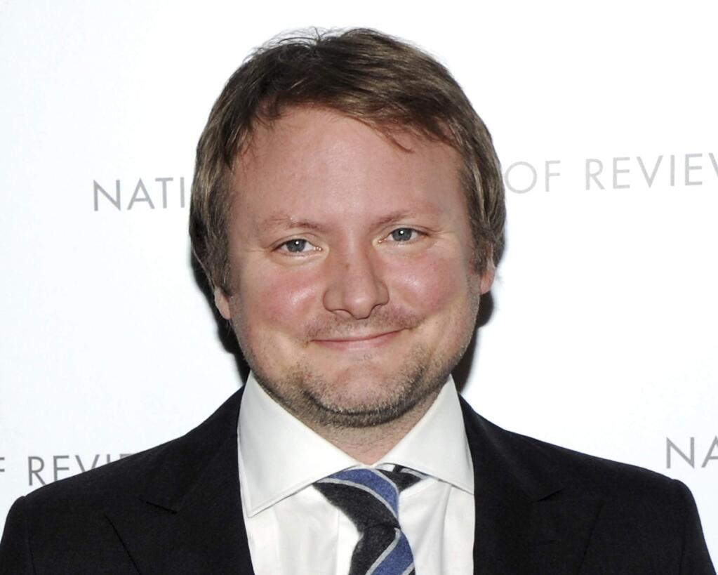 FILE - In this Jan. 8, 2013 file photo, screenwriter Rian Johnson attends the National Board of Review Awards gala in New York. The Walt Disney Co. has announced that Johnson will create a new trilogy for the “Star Wars” universe, greatly expanding the director's command over George Lucas' ever-expanding space saga. (Photo by Evan Agostini/Invision/AP, File)