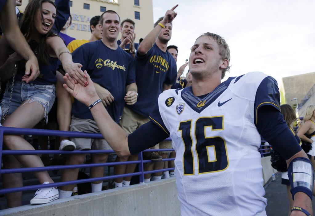 Cal quarterback Jared Goff celebrates with fans after Cal defeated Northwestern 31-24 in a game in Evanston, Ill., Saturday, Aug. 30, 2014. (AP Photo/Nam Y. Huh)