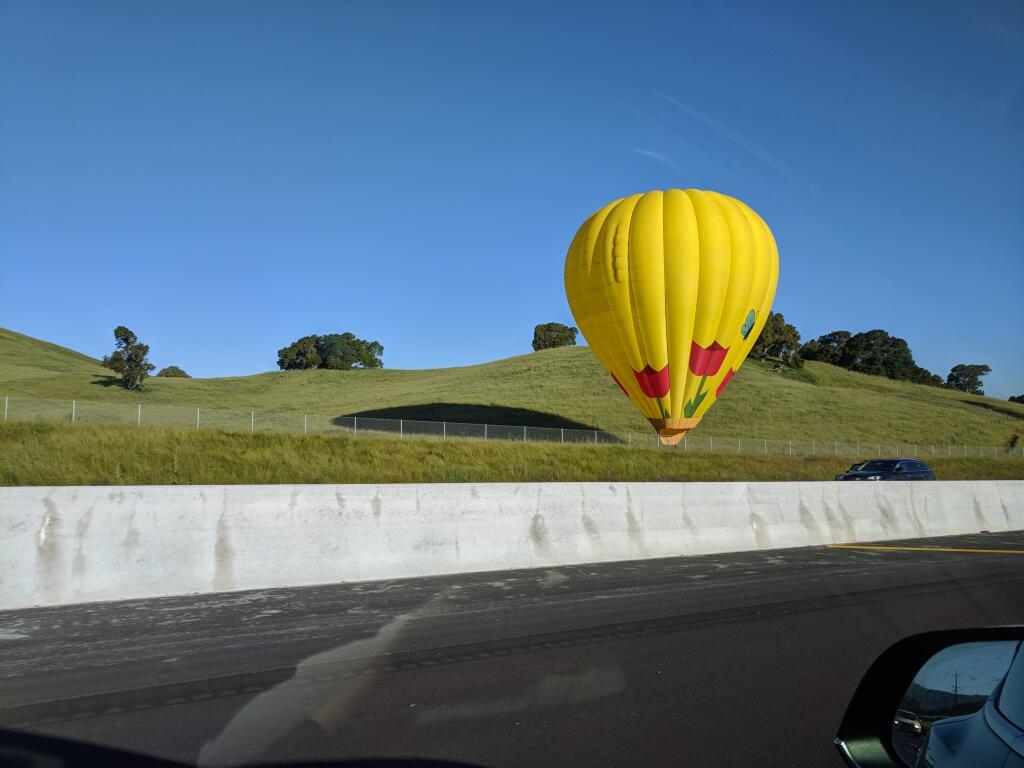 Two hot air balloons landed adjacent to southbound Highway 101 lanes close to the Cotati Grade on Thursday morning.