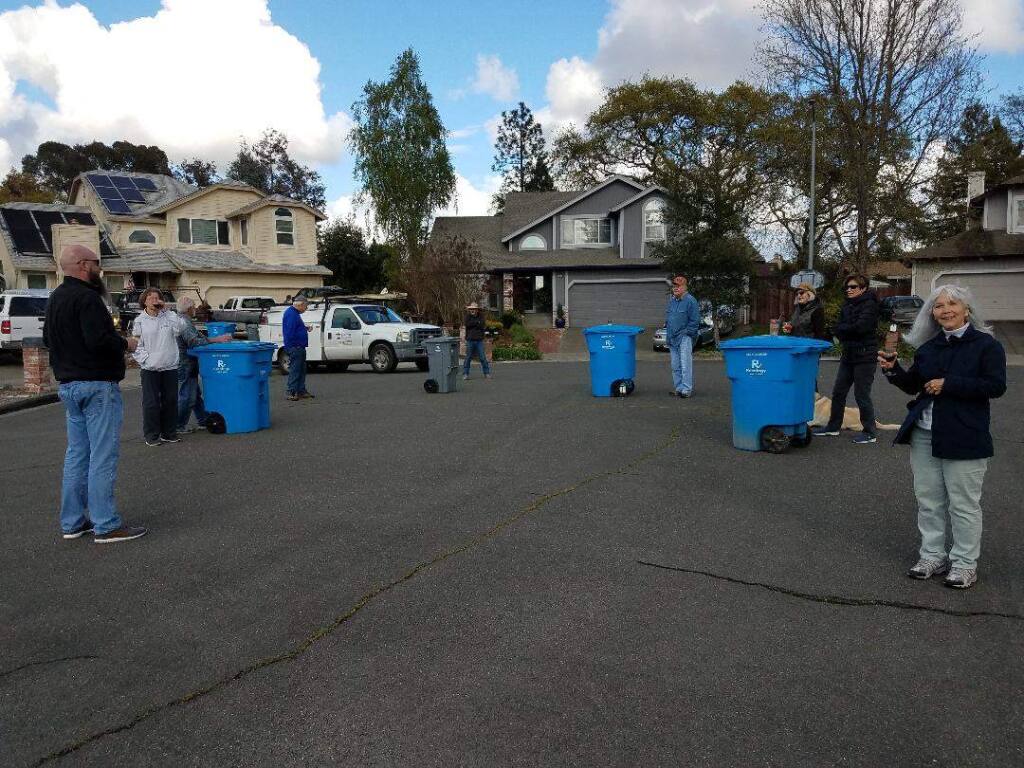 Cul-de-sac neighbors on Santa Rosa's Meridian Circle practice social distancing and savor liquid refreshment at their first Trash (can) Talk Tuesday gathering. (Gayle Pickrell)