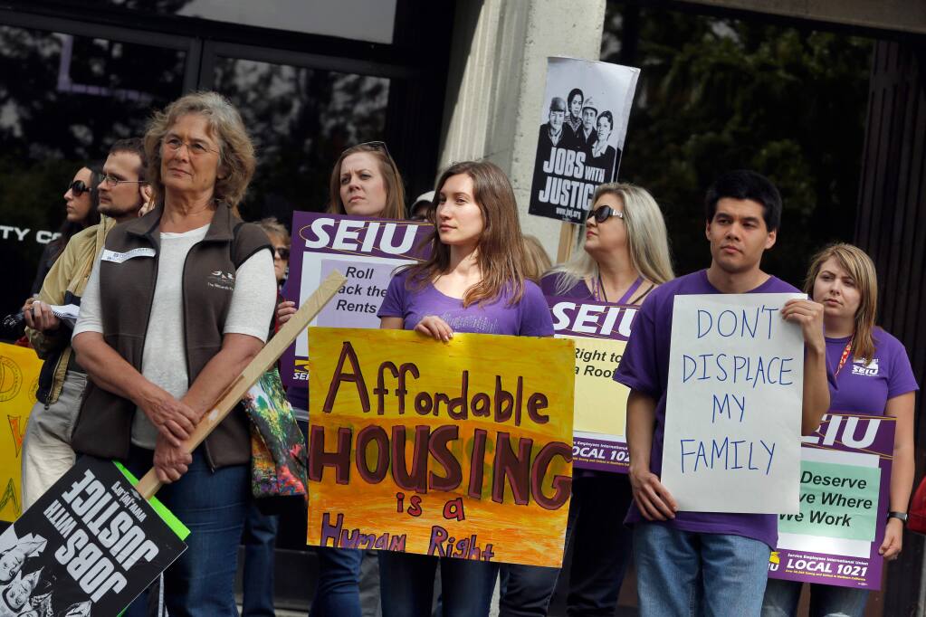 FILE - Demonstrators in support of affordable housing rally outside the Santa Rosa city council chambers before a council meeting to discuss rent control in Santa Rosa, California on Tuesday, May 3, 2016. (Alvin Jornada / The Press Democrat)
