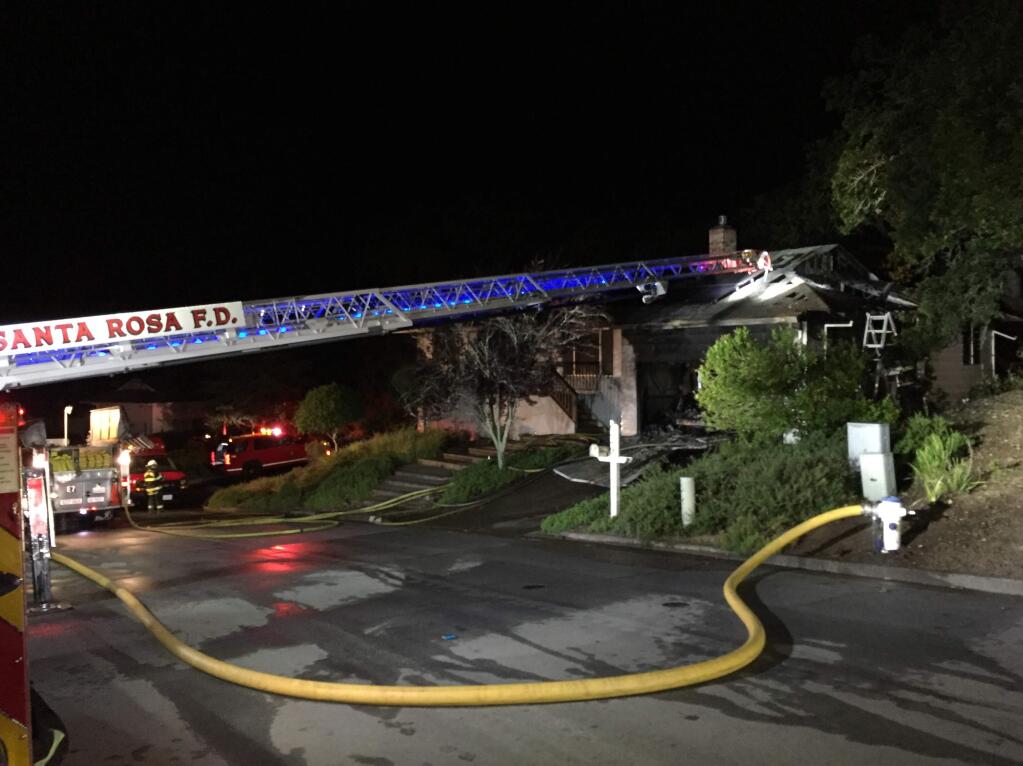 Firefighters battle a blaze at an Oakmont home on Monday, April 30, 2018. (COURTESY OF SANTA ROSA BATTALION CHIEF MARK BASQUE)