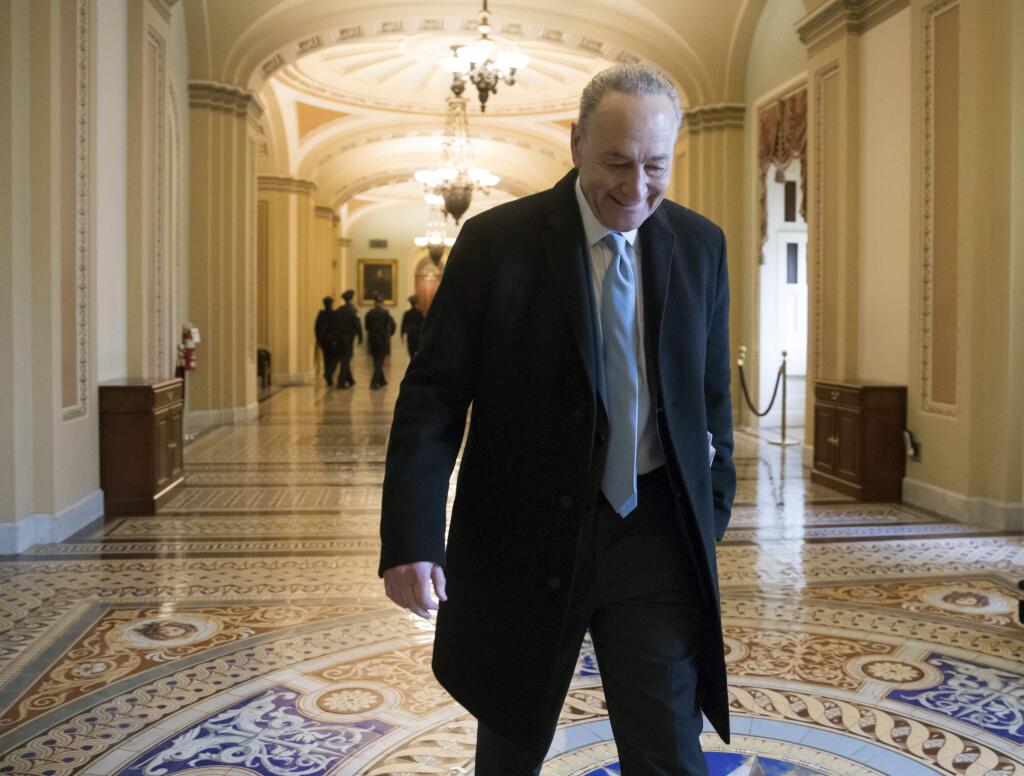 Senate Minority Leader Chuck Schumer, D-N.Y., arrives at the Capitol at the start of the third day of the government shutdown, in Washington, Monday, Jan. 22, 2018. The federal government was on track to resume business Monday, after Senate Democrats backed off their demands and agreed to support a temporary spending bill in return for a promise that the Senate will debate immigration policy soon. (AP Photo/J. Scott Applewhite)