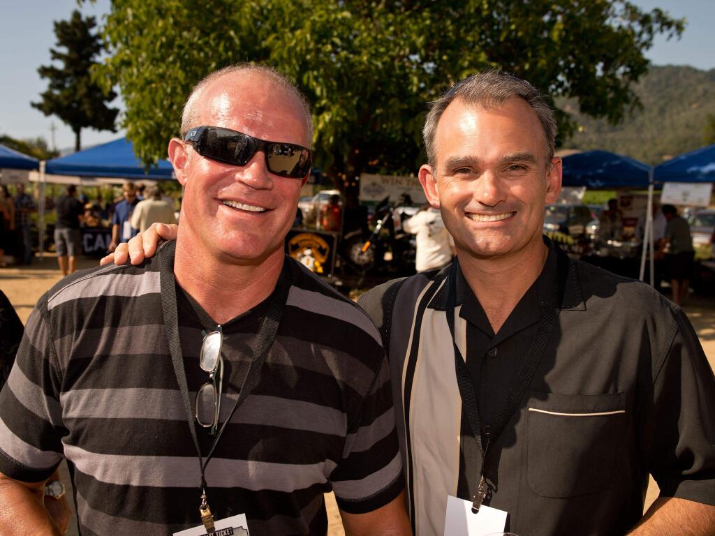 12/13/2013:B3: Capt. Hank SchreederPC: Larry Dashiell, left, and Santa Rosa Police Captain Hank Schreeder attend the CigarBQ benefit for the Meals on Wheels program of the Council on Aging, at Soda Rock Winery in Healdsburg, Calif., on July 20, 2013. (Alvin Jornada / For The Press Democrat)