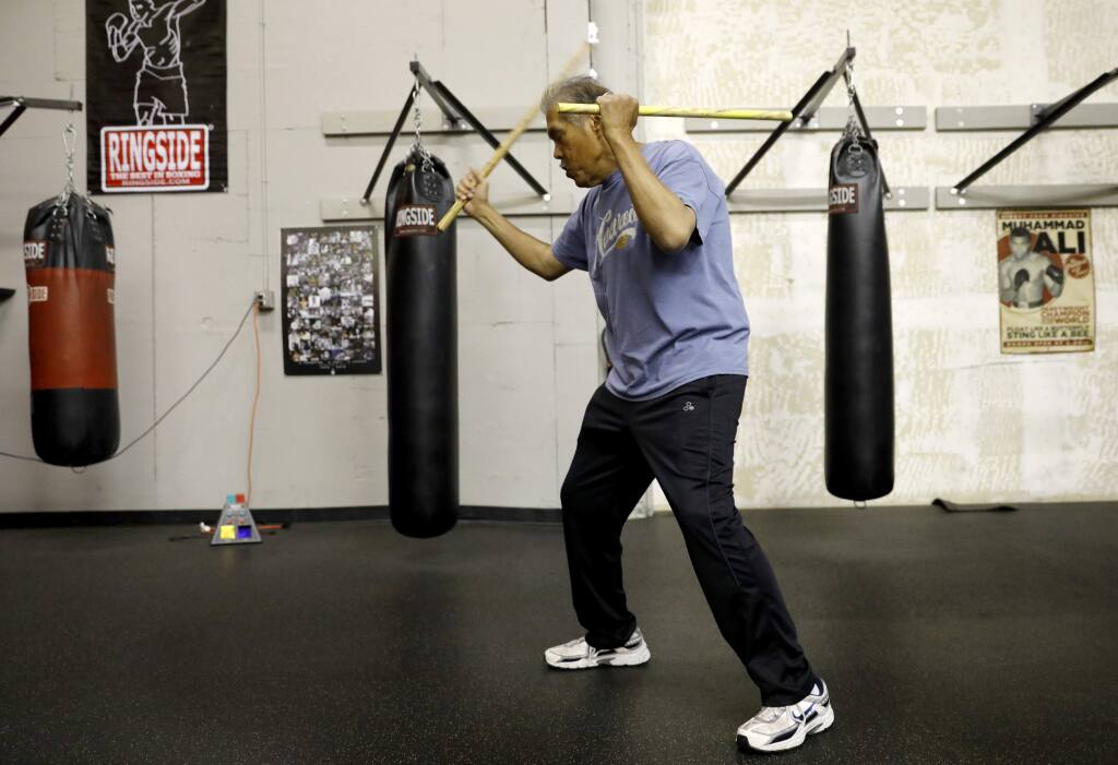 Rene Latosa, a grand master of Filipino martial arts, works out at Ringtime Fitness in Santa Rosa on Tuesday, May 15, 2018. (Beth Schlanker/ The Press Democrat)