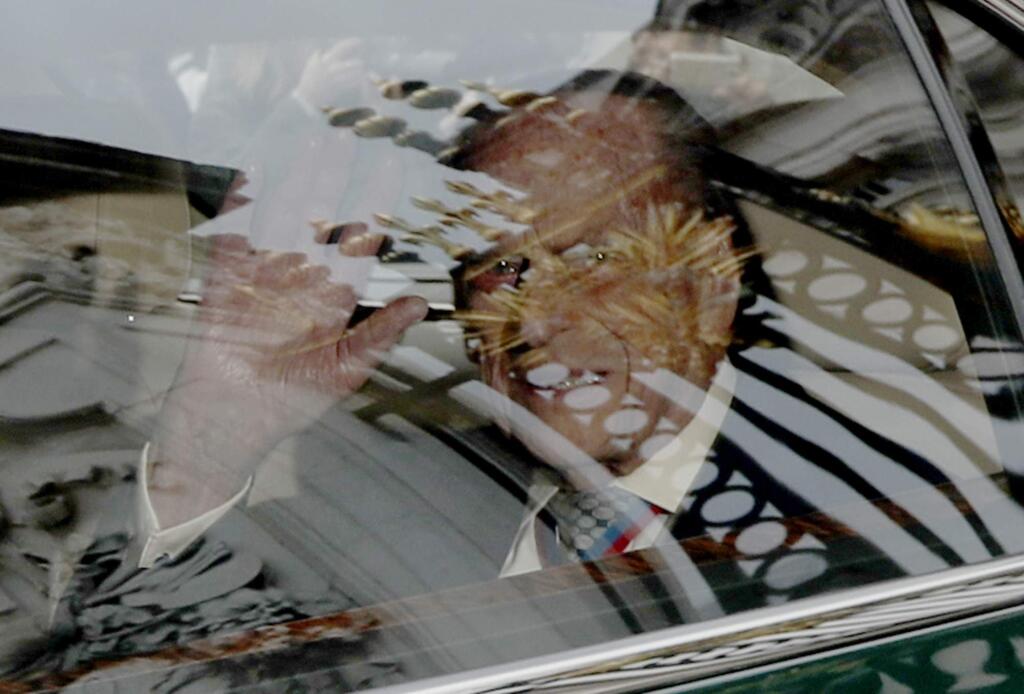 Britain's Prince Philip, the Duke of Edinburgh waves as he leaves in a car with the Queen from Buckingham Palace in London, Thursday, May 4, 2017. Prince Philip, the consort known for his constant support of his wife Queen Elizabeth II as well as for his occasional gaffes, will retire from royal duties this fall, Buckingham Palace said Thursday. (AP Photo/Matt Dunham)