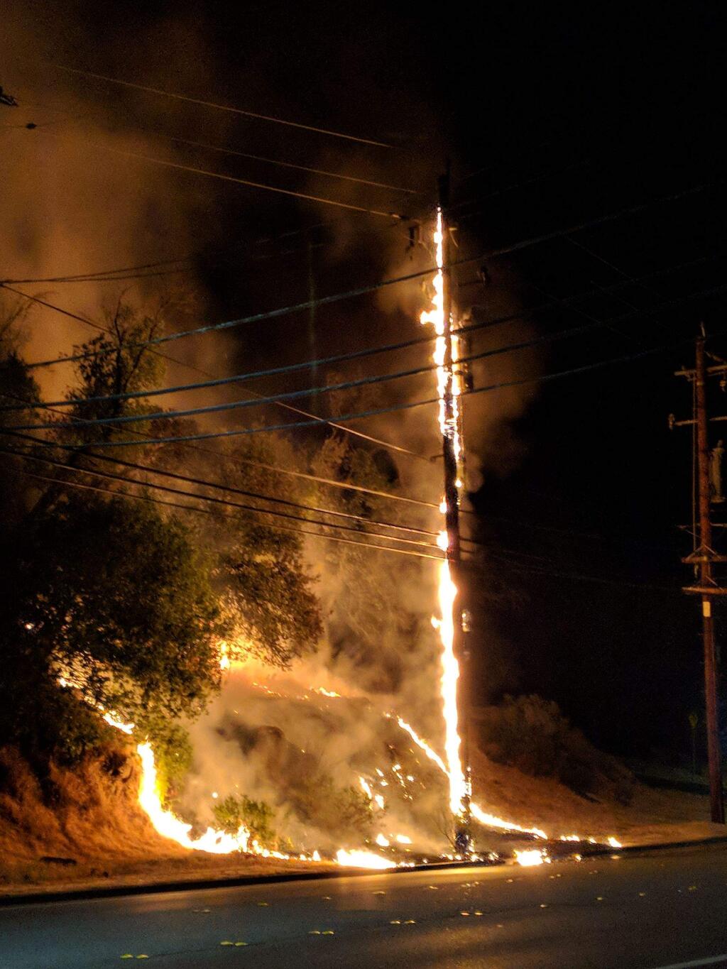 A failed PG&E voltage regulator caused a small grass and brush fire near Howarth Park Wednesday evening, temporarily knocking out power to thousands of customers near Summerfield Road and Sonoma Avenue, officials said. (Photo: Jenny L. Van Sistine)