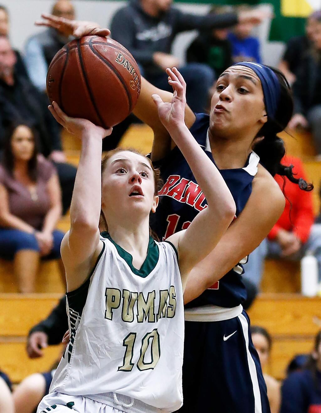 Rancho Cotate's Keyonee Neal, right, blocks a shot by Maria Carrillo's Adrianna Brandt during the first half between Rancho Cotate and Maria Carrillo high schools in Santa Rosa on Tuesday, February 4, 2020. (Alvin Jornada / The Press Democrat)
