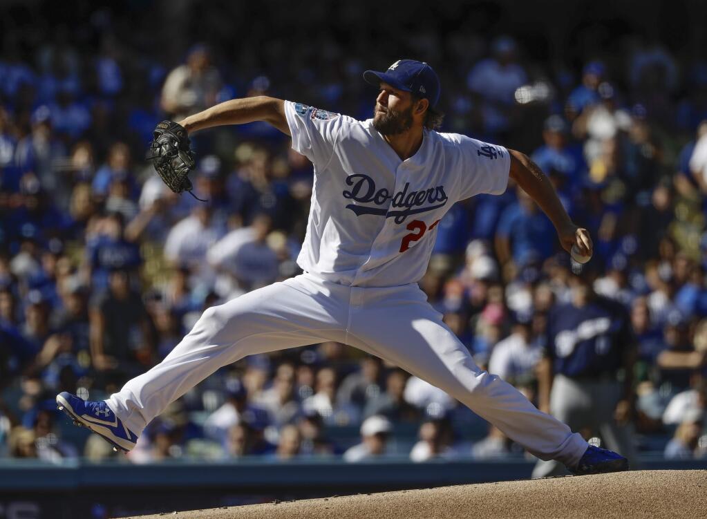 Los Angeles Dodgers starting pitcher Clayton Kershaw throws during the first inning of Game 5 of the National League Championship Series against the Milwaukee Brewers Wednesday, Oct. 17, 2018, in Los Angeles. (AP Photo/Matt Slocum)