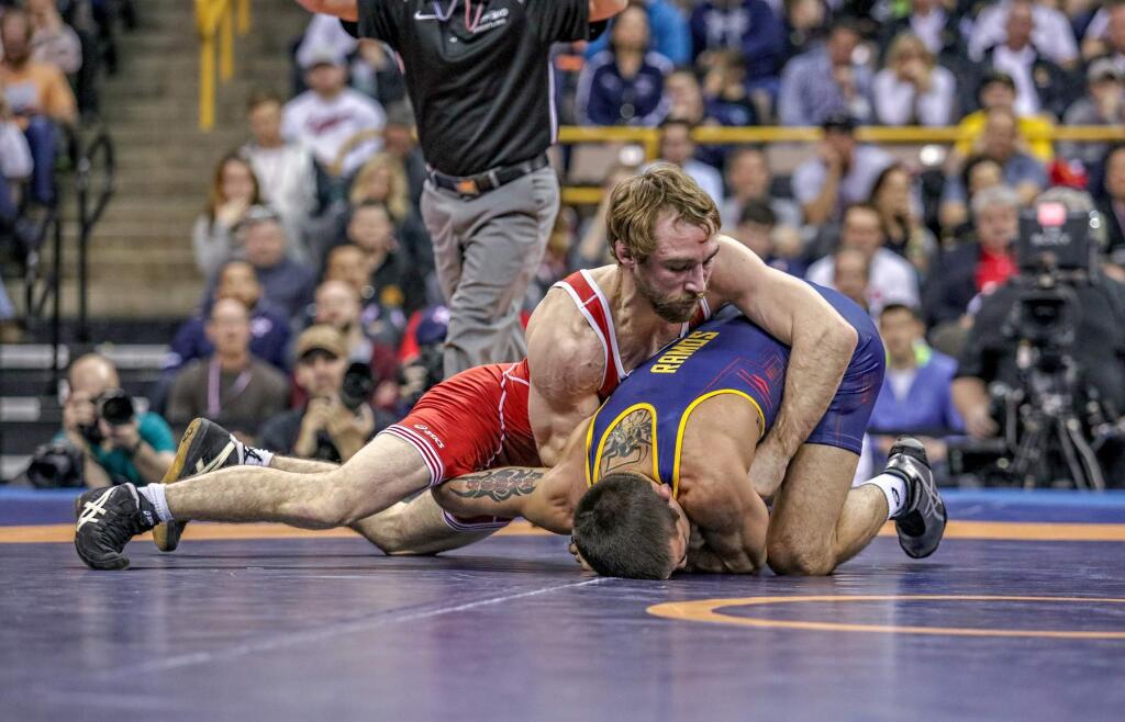Windsor High School wrestling assistant coach Dan Dennis, top, wrestles against former college teammate and 2014 NCAA champion Tony Ramos in the 57kg (125.6 pounds) final at the U.S. Olympic Team Trials at Iowa City in April. Dennis defeated Ramos to win a spot on the 2016 U.S. Olympic team. (Photo by John Sachs)