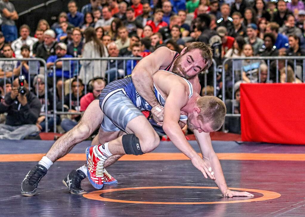 Daniel Dennis, a Windsor High School assistant wrestling coach, works his advantage 2012 U.S. Olympian Sam Hazewinkel in their championship match at the 2015 U.S. Senior Nationals Finals in December in Las Vegas. (Photo by John Sachs)
