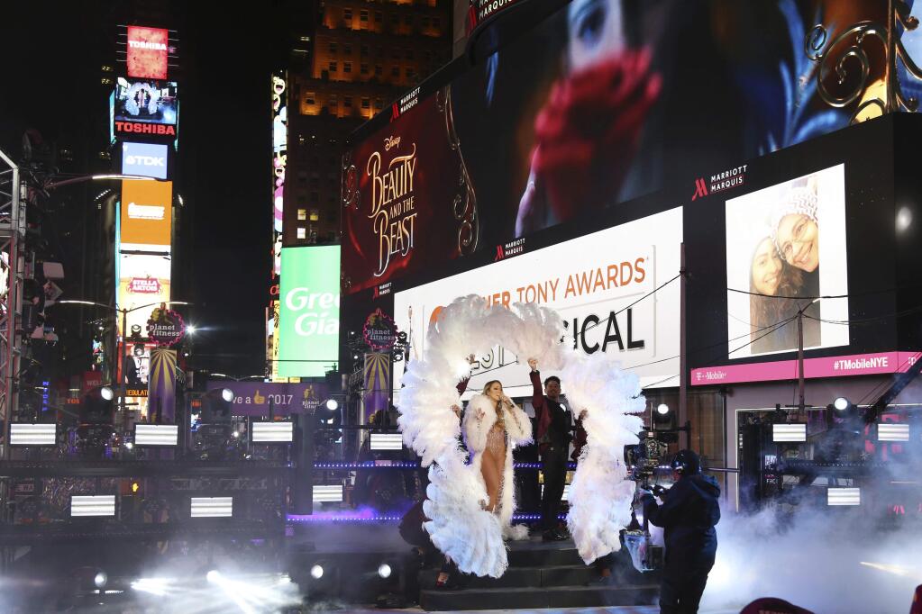 FILE - In this Dec. 31, 2016, file photo, Mariah Carey performs at the New Year's Eve celebration in Times Square in New York. Carey told Entertainment Weekly in an interview published online Jan. 3, 2017, that she was was “mortified” in “real time” during the disastrous live performance in which she stumbled through several songs. (Photo by Greg Allen/Invision/AP, File)