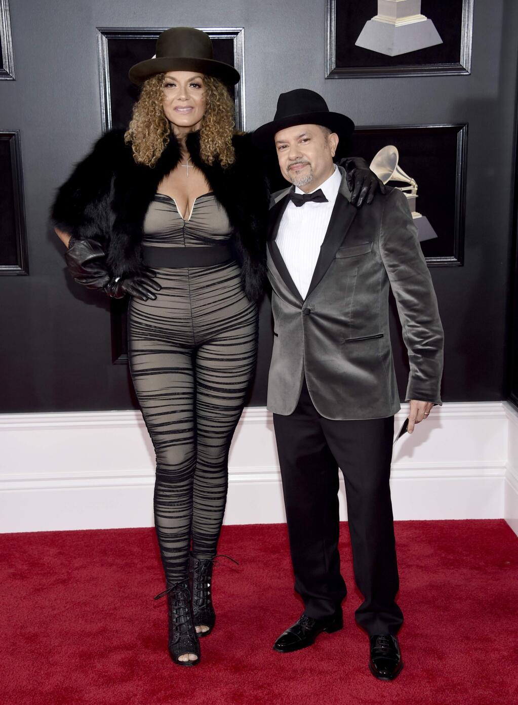 Ana Martins, left, and Little Louie Vega arrive at the 60th annual Grammy Awards at Madison Square Garden on Sunday, Jan. 28, 2018, in New York. (Photo by Evan Agostini/Invision/AP)
