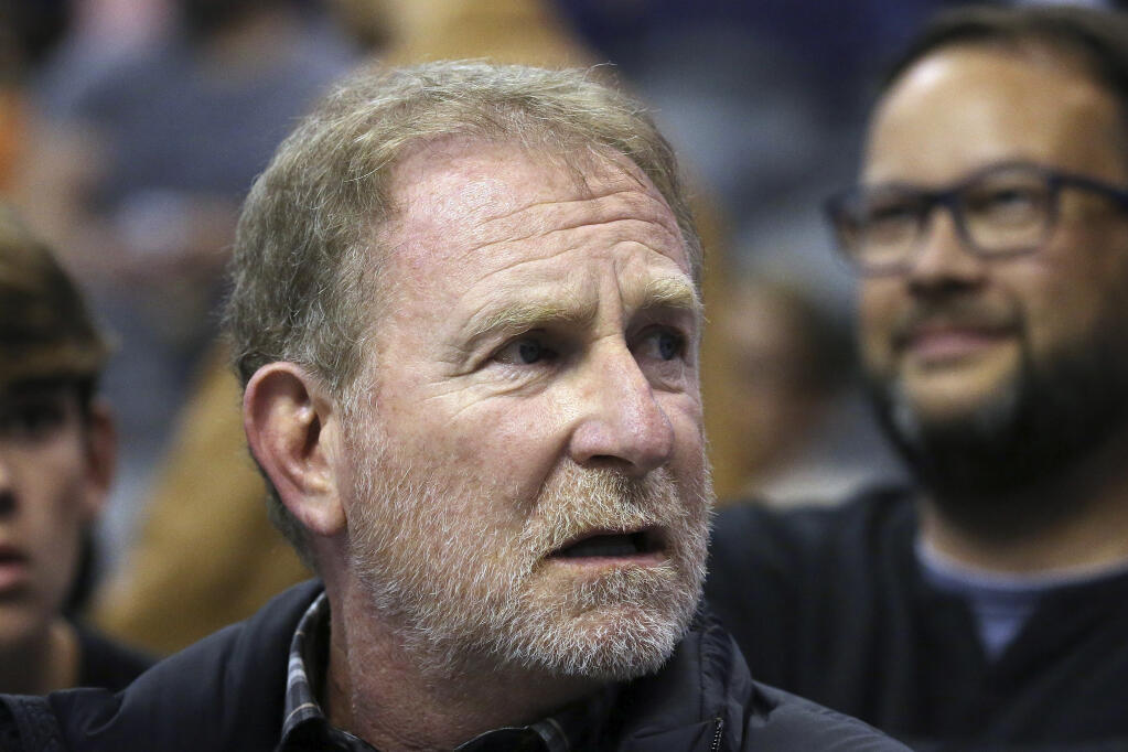 FILE- Phoenix Suns owner Robert Sarver watches his team play against the Memphis Grizzlies during the second half of an NBA basketball game on Dec. 11, 2019 in Phoenix. PayPal said Friday, Sept. 16, 2022, that the company will no longer sponsor the Phoenix Suns if owner Robert Sarver remains part of the franchise when his suspension ends. Sarver was suspended this week, plus fined $10 million, after an investigation showed a pattern of lewd, misogynistic, and racist speech and conduct during his 18 years as owner of the Suns. (AP Photo/Ross D. Franklin)