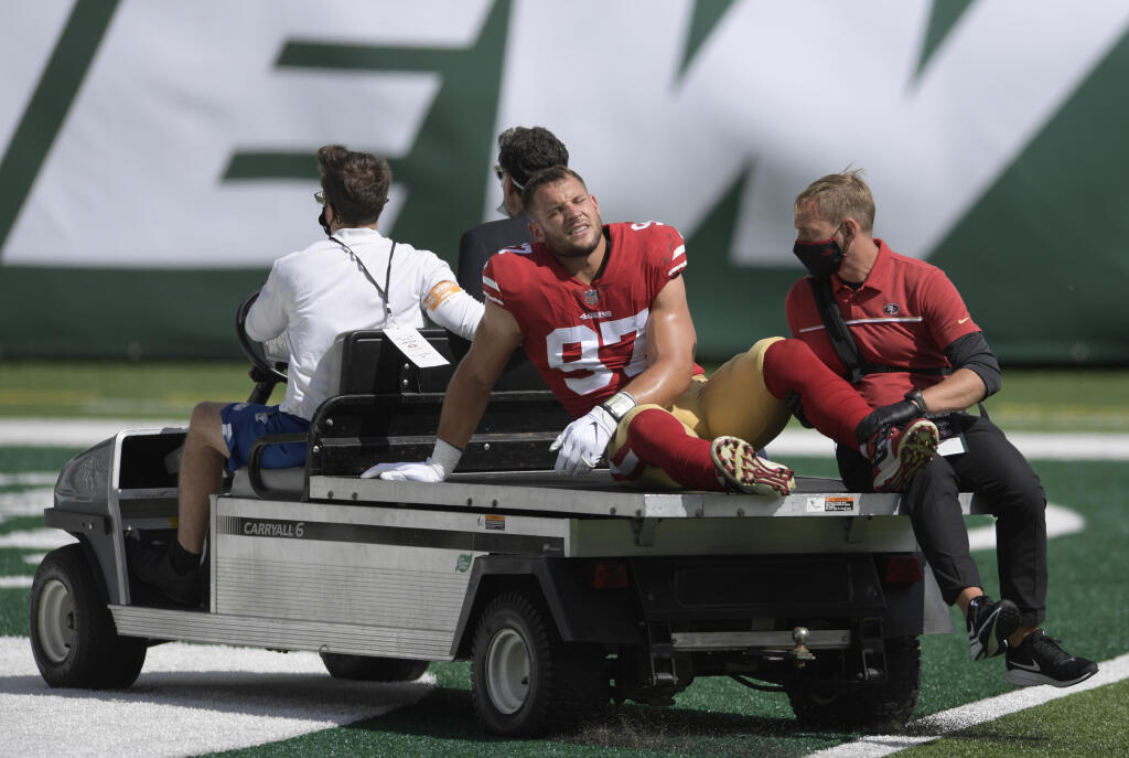 San Francisco 49ers defensive end Nick Bosa (97) is driven off the field after being injured during the first half of an NFL football game against the New York Jets Sunday, Sept. 20, 2020, in East Rutherford, N.J. (AP Photo/Bill Kostroun)