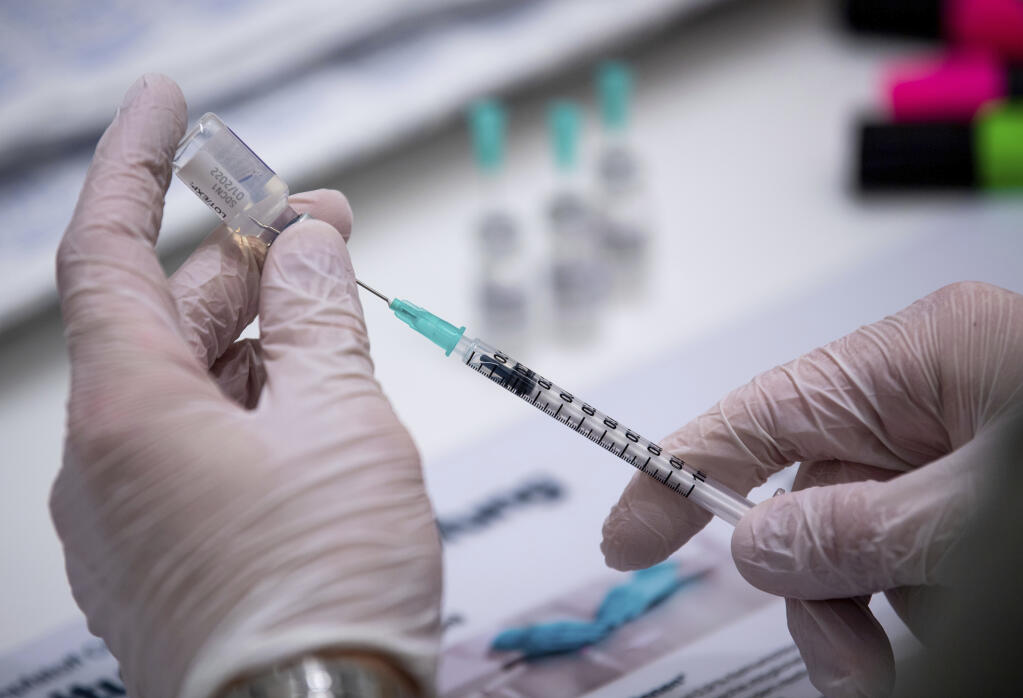 Sonoma County adults can get booster shots if at least six months have passed since they received a second dose of the Pfizer or Moderna vaccines. People who got the Johnson & Johnson vaccine are urged to get a booster after two months. (Lino Mirgeler/dpa via AP)