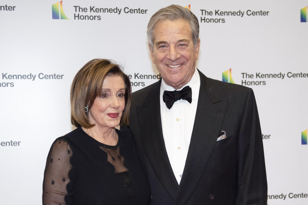 FILE - Speaker of the House Nancy Pelosi, D-Calif., and her husband, Paul Pelosi, arrive at the State Department for the Kennedy Center Honors State Department Dinner, on Dec. 7, 2019, in Washington. On Friday, Oct. 28, 2022, a man broke into House Speaker Nancy Pelosi’s California home and severely beat her husband, Paul Pelosi, with a hammer. The 82-year-old underwent surgery to repair a skull fracture and serious injuries to his right arm and hands, and his doctors expect a full recovery, the speaker’s office said Friday. There were no updates on his condition Saturday. (AP Photo/Kevin Wolf, File)