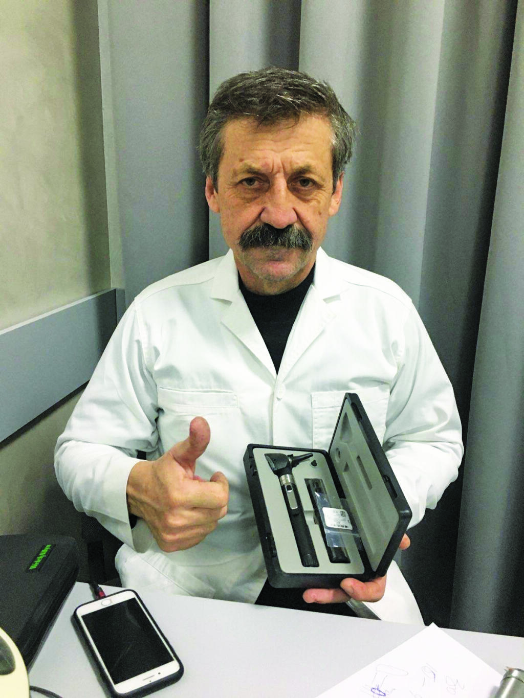 This Ukrainian ear, nose and throat doctor gives a "thumb's up" after receiving an otoscope kit via a donation coordinated by Santa Rosa audiologist Peter Marincovich and Exchange Bank trust officer Andriy Lsyshyn. The scopes help diagnose hearing loss among patients due to loud noise from bursting shells during the war. (Courtesy: Peter Marincovich and Andriy Lesyshyn)