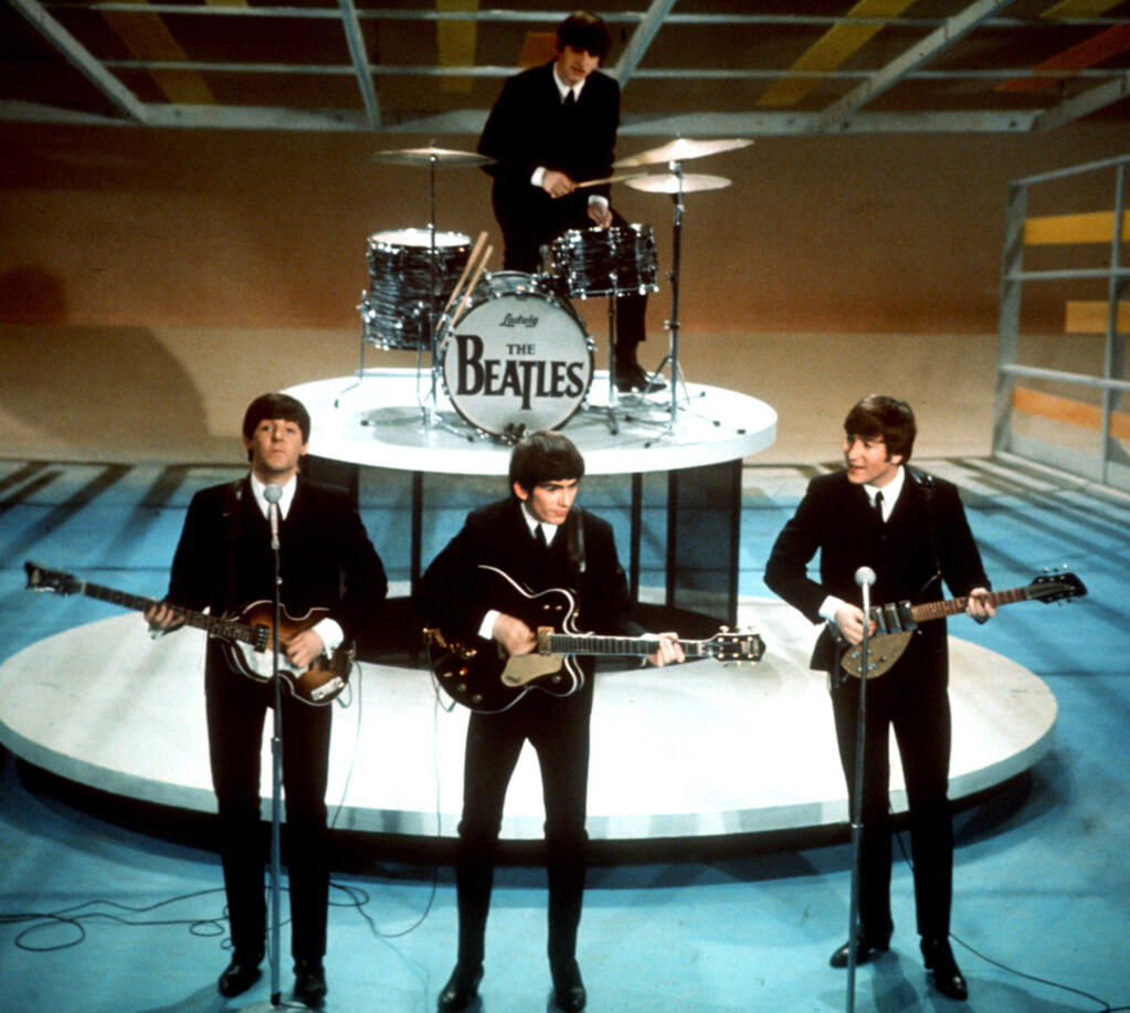 In this Feb. 9, 1964 file photo, The Beatles, from left, Paul McCartney, George Harrison, Ringo Starr on drums, and John Lennon perform on the CBS "Ed Sullivan Show" in New York. (AP Photo, File)