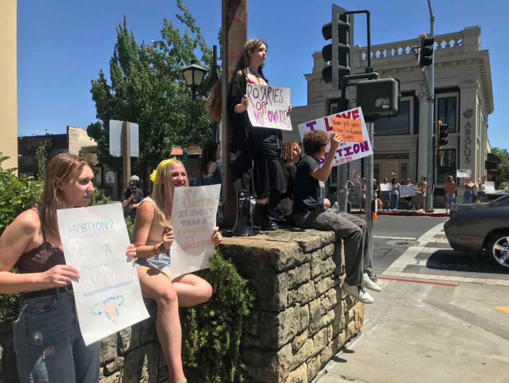 High school and middle school students gathered at the intersection of Bodega Ave. and Hwy 116 in Downtown Sebastopol on Saturday, May 21, 2022, to protest for abortion rights nationwide. (Kylie Lawrence / Press Democrat)
