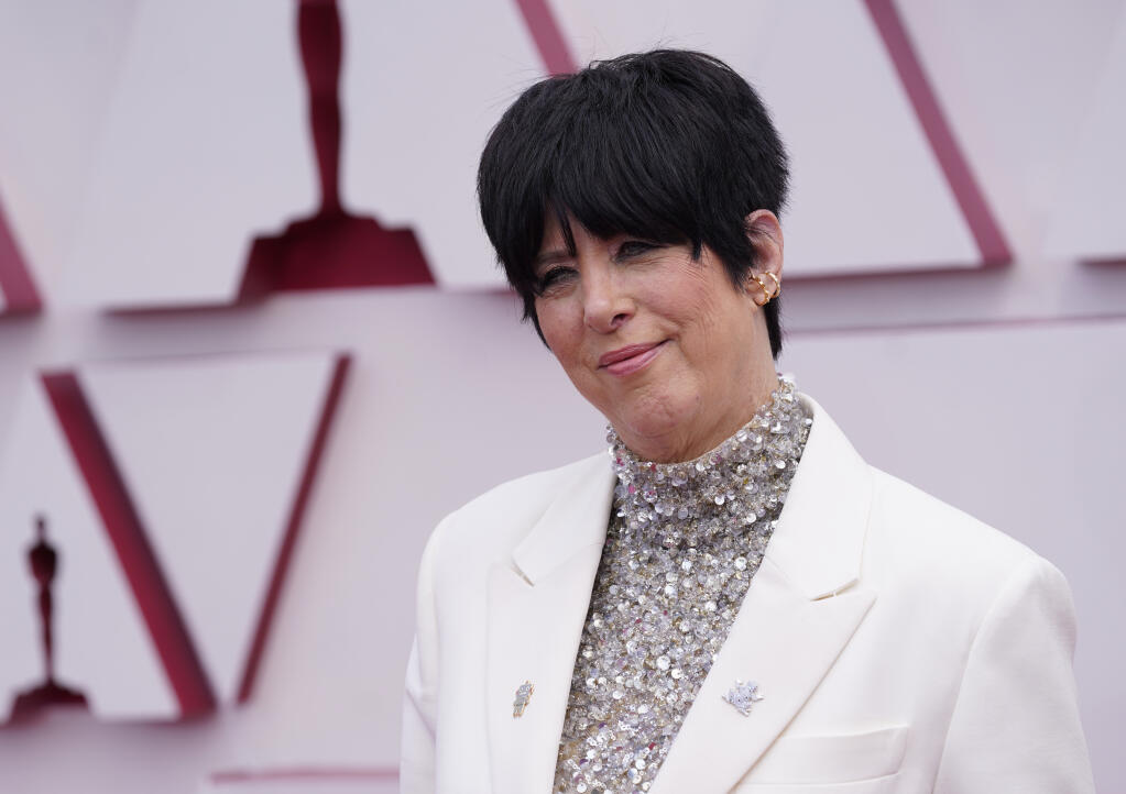 File-This April 25, 2021, file photo shows Diane Warren arriving at the Oscars at Union Station in Los Angeles.  Warren stepped in Thursday, June 24, 2021, to save the life of cow that eluded capture for more than a day after a herd escaped from a Southern California slaughterhouse and stampeded through a suburb.The Grammy-winning artist contacted the city of Pico Rivera to arrange to have the cow sent to the Farm Sanctuary north of Los Angeles, Warren and City Manager Steve Carmona said. (AP Photo/Chris Pizzello, Pool, File)