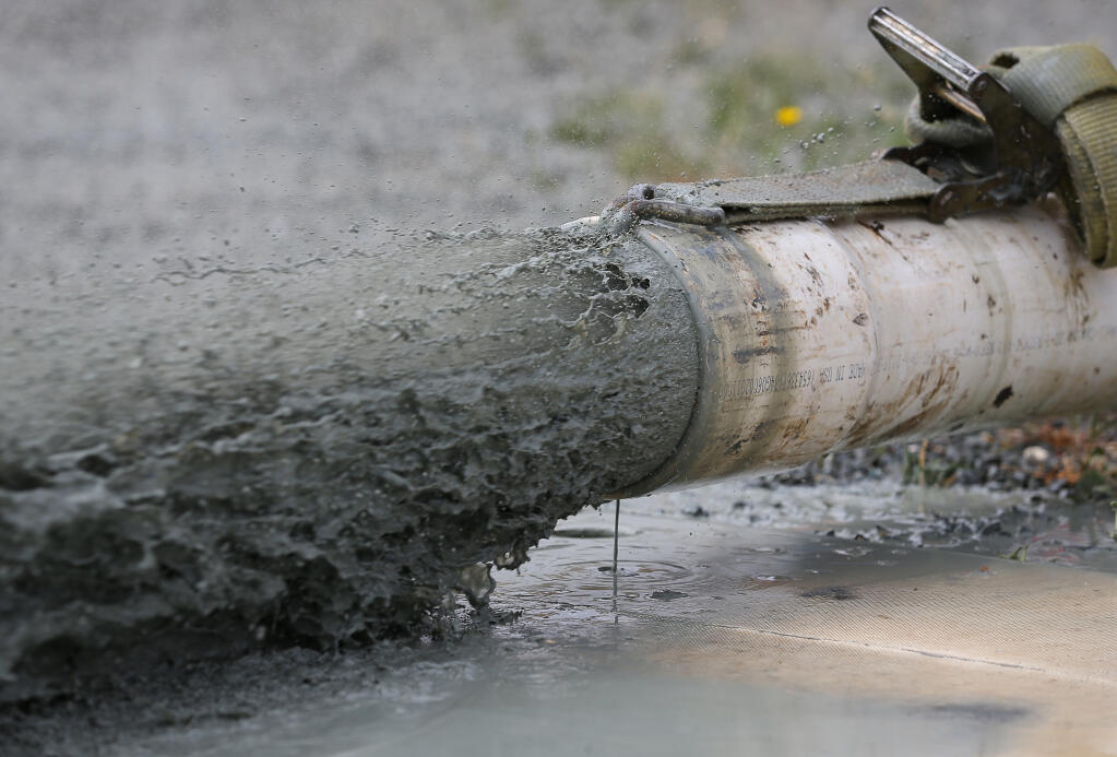 Water begins to flow from a pipe on a new well on a vineyard property near Sonoma on Tuesday, June 22, 2021.  (Christopher Chung/ The Press Democrat)