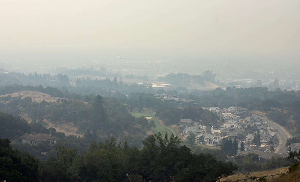 Smoke from the Walbridge fire brought bad air quality over Santa Rosa, seen from Fountaingrove looking south on Monday, Aug. 24, 2020.  (John Burgess / The Press Democrat)