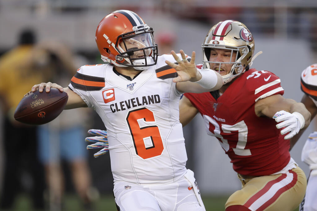 Then-Cleveland Browns quarterback Baker Mayfield is pressured by 49ers defensive end Nick Bosa during the first half of a 2019 game in Santa Clara. (Ben Margot / ASSOCIATED PRESS)