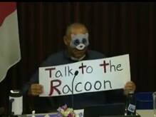 Santa Rosa City Schools board member dons raccoon mask and sign in response to racial attacks