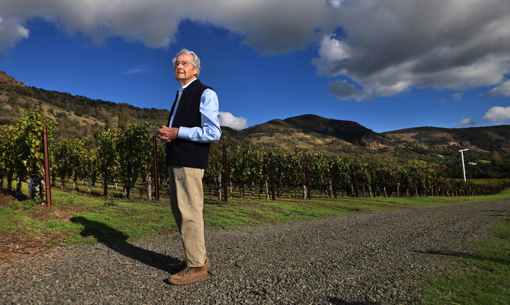 Warren Winiarski, 92, at his Arcadia Vineyards in the Coombsville AVA of Napa Valley, which produces chardonnay, cabernet sauvignon and merlot. The 2017 Atlas fire burned structures on the property, as well as the mountains in the background. (Kent Porter / The Press Democrat) 2021