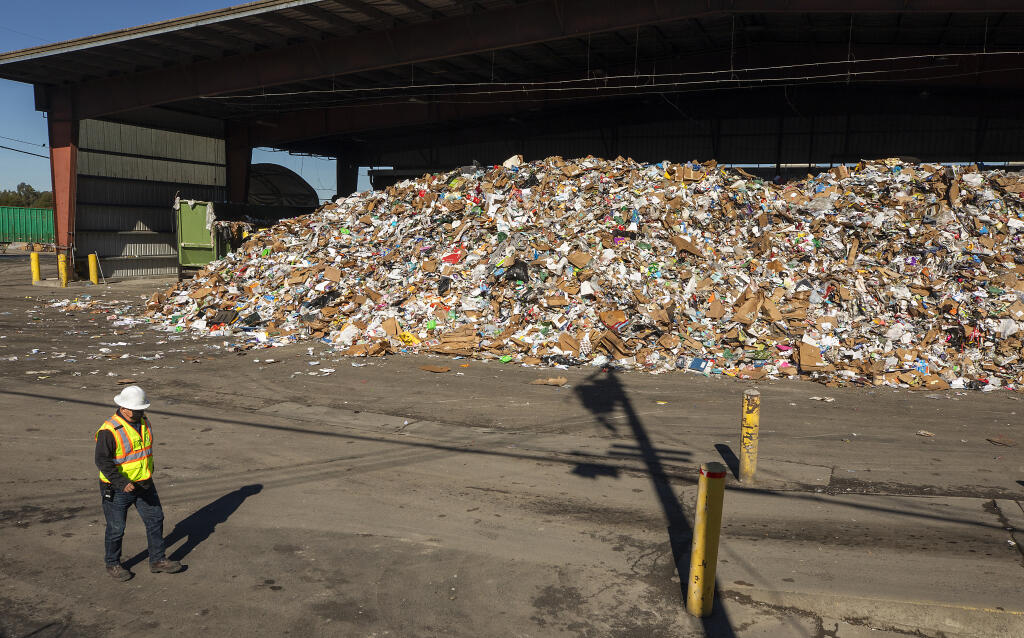 Mounds of recycling wait to be separated and processed at the Recology Sonoma Marin Recycling Center on Feb. 4, 2021. (Photo by John Burgess/The Press Democrat)